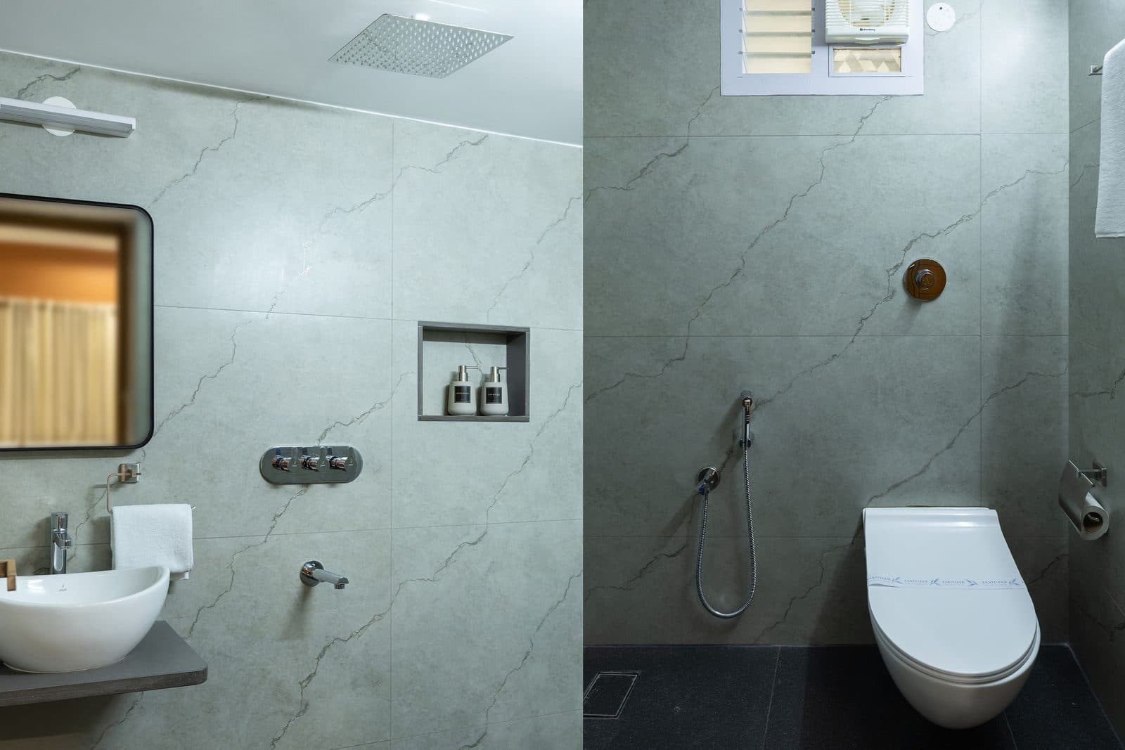 The other ground-floor bathroom: a basin and mirror, with the rain shower and toilet alongside