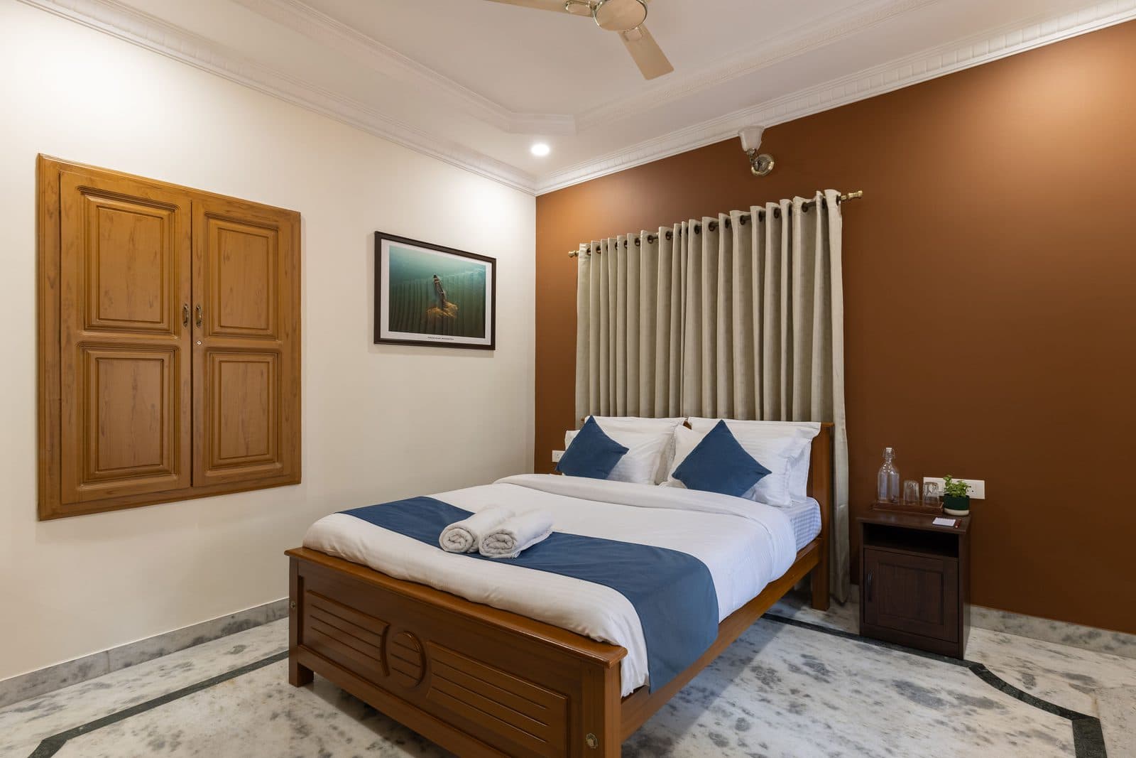 Room 2 with the wardrobe and a framed bird print above the bed
