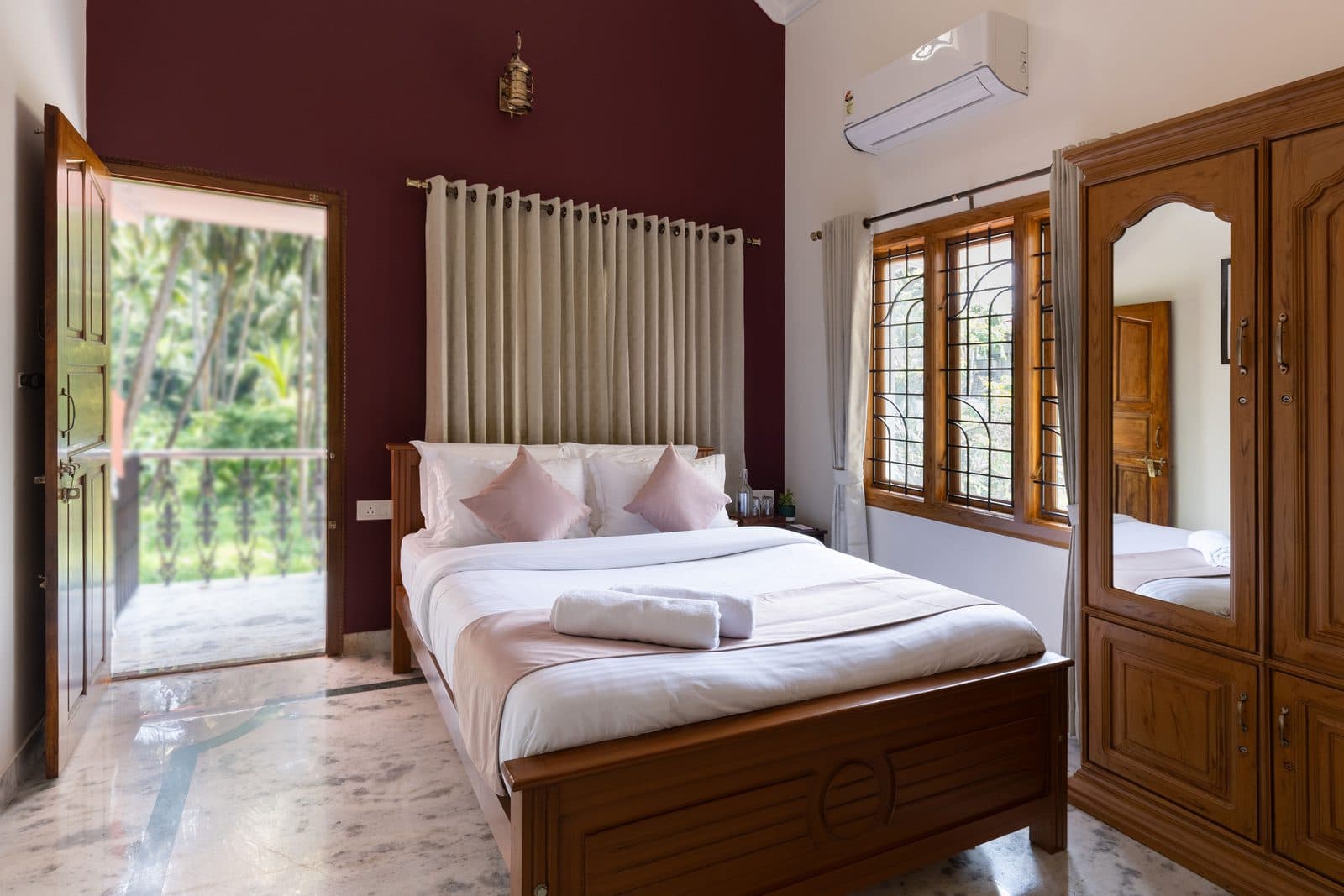 Room 3 with the balcony door open onto the trees outside, and the mirrored wardrobe alongside