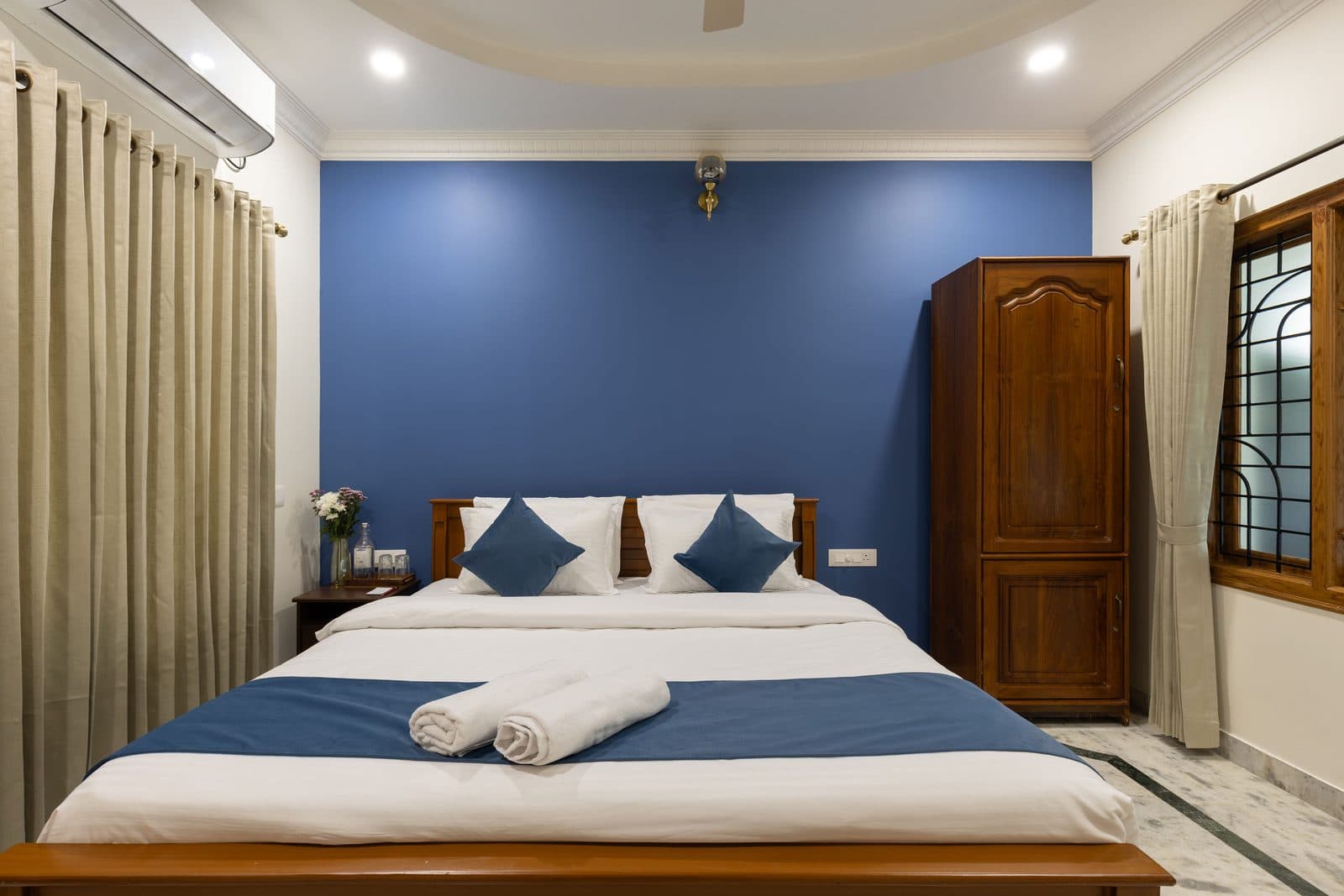 Room 4 from the foot of the bed, with the grilled window and the wardrobe